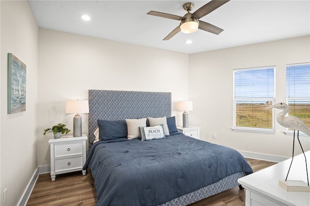 bedroom featuring ceiling fan and dark wood-type flooring