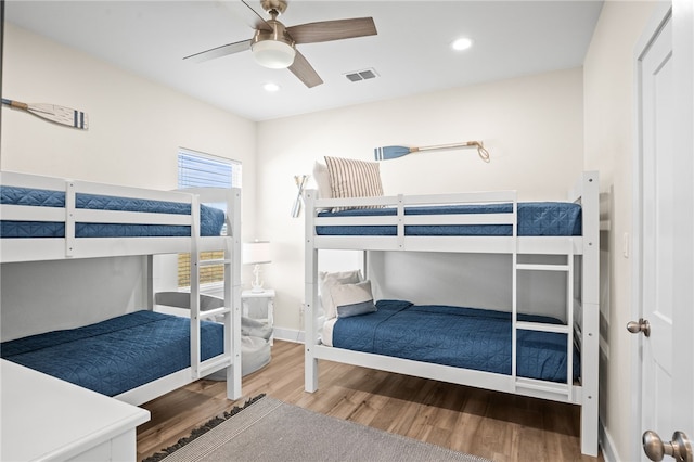 bedroom featuring ceiling fan and hardwood / wood-style flooring