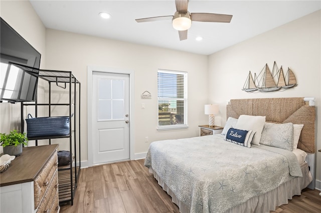 bedroom featuring ceiling fan and hardwood / wood-style flooring