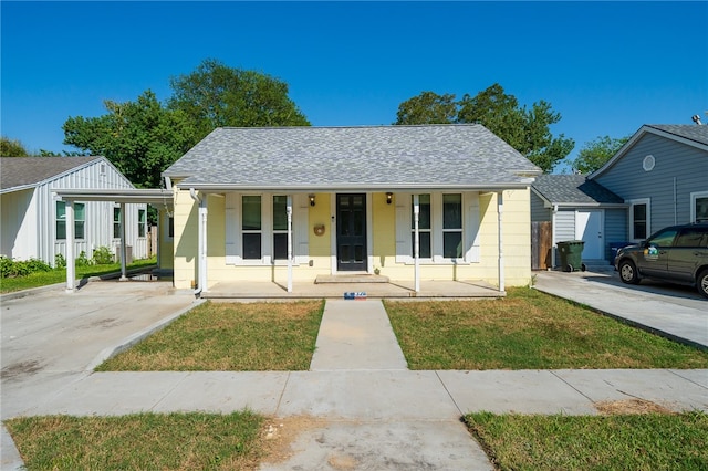 bungalow-style house with a porch and a front lawn