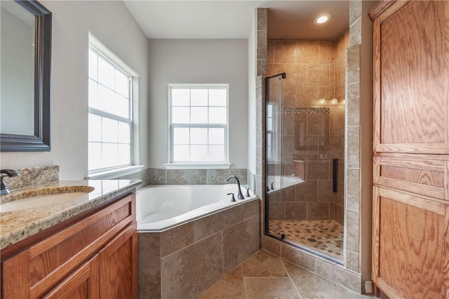 7205 Lake Serenity Dr, Corpus Christi, TX 78414 - bathroom featuring vanity, a bath, a stall shower, and recessed lighting