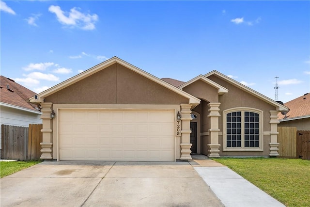 7205 Lake Serenity Dr, Corpus Christi, TX 78414 - view of front facade with stucco siding, an attached garage, and driveway