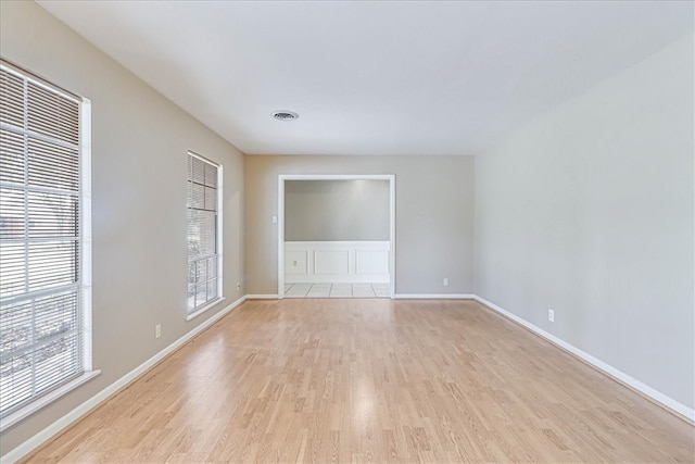 spare room with light wood-type flooring