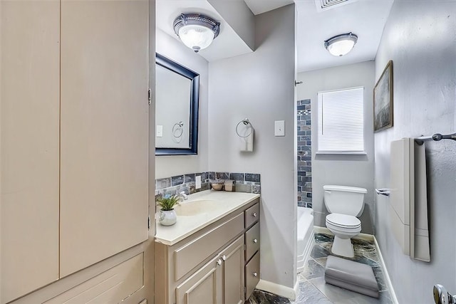 bathroom featuring tile patterned flooring, vanity, and toilet