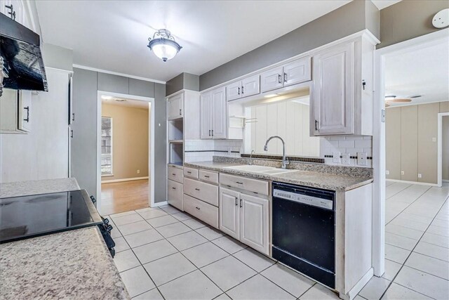 kitchen featuring sink, black dishwasher, tasteful backsplash, extractor fan, and white cabinets