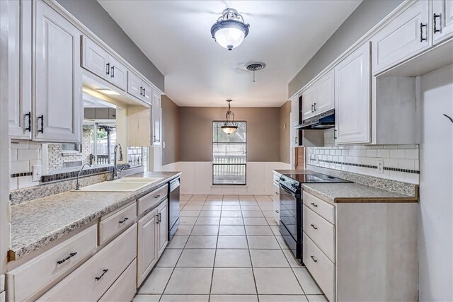 kitchen featuring white cabinetry, plenty of natural light, and black electric range oven