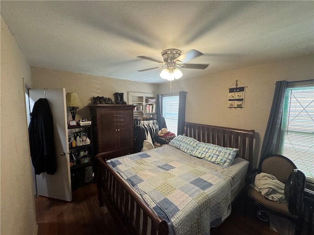 1210 Brentwood Dr, Corpus Christi, TX 78404 - bedroom featuring a ceiling fan, dark wood finished floors, and a textured wall