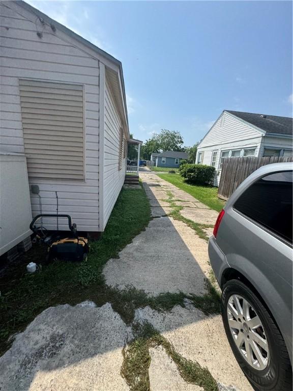 1210 Brentwood Dr, Corpus Christi, TX 78404 - view of side of home with fence