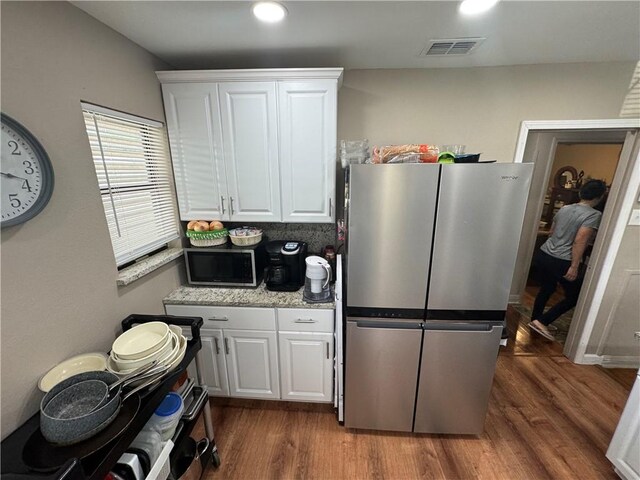 1210 Brentwood Dr, Corpus Christi, TX 78404 - kitchen featuring dark wood-style flooring, visible vents, stainless steel appliances, recessed lighting, and white cabinetry
