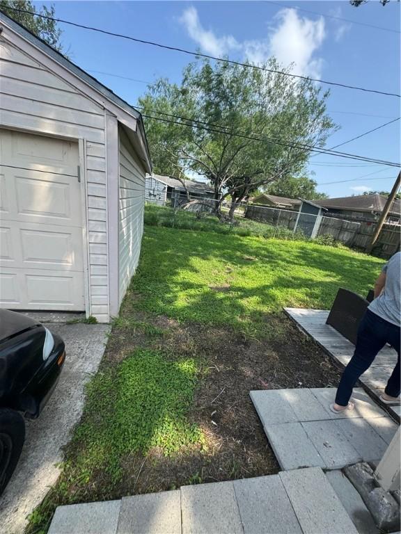 1210 Brentwood Dr, Corpus Christi, TX 78404 - view of yard with fence and a garage