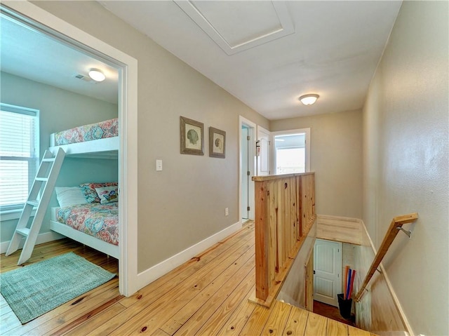 hall with light hardwood / wood-style flooring