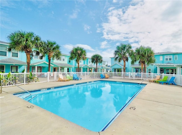 view of swimming pool with a patio area