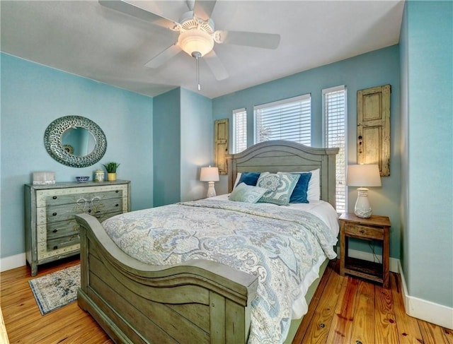 bedroom featuring hardwood / wood-style flooring and ceiling fan