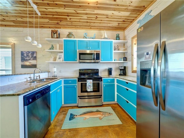 kitchen featuring pendant lighting, appliances with stainless steel finishes, blue cabinets, and sink