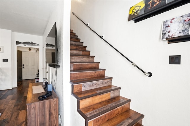 staircase featuring wood finished floors