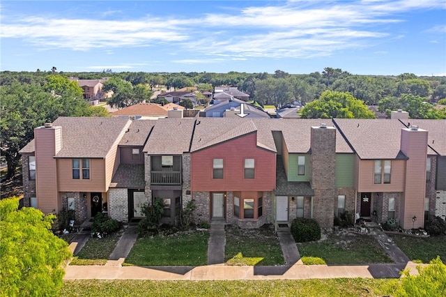 birds eye view of property with a residential view