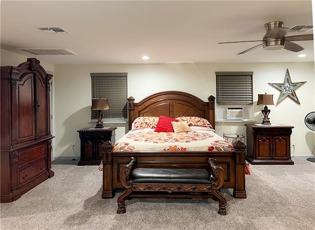 carpeted bedroom with ceiling fan and cooling unit