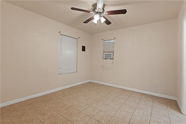 spare room with light tile patterned floors, ceiling fan, and cooling unit