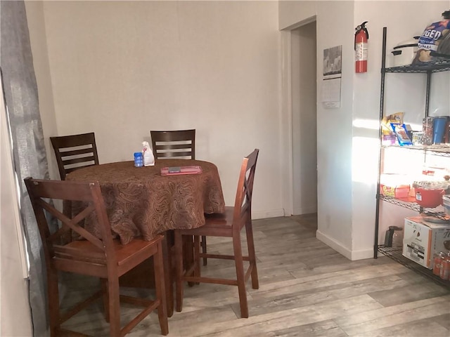 dining area with light hardwood / wood-style flooring