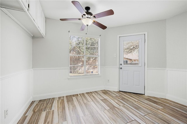 interior space with ceiling fan and light wood-type flooring