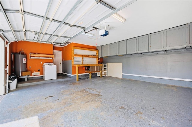 garage with washer / clothes dryer, a garage door opener, and water heater