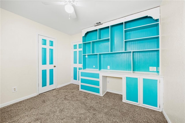 interior space featuring ceiling fan and carpet flooring