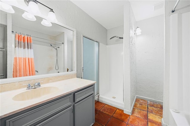 bathroom with vanity and curtained shower