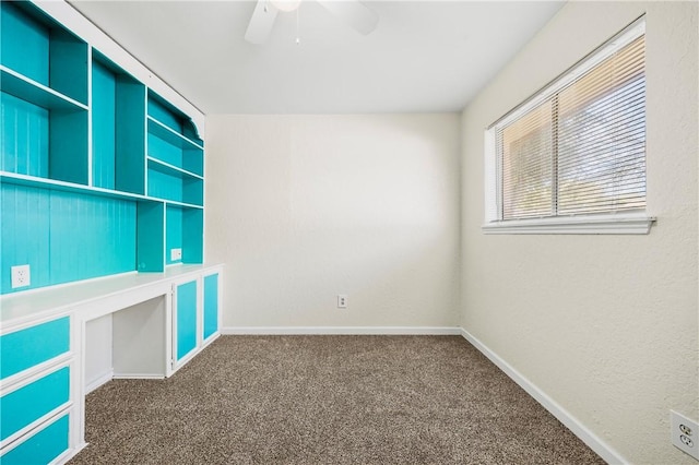 carpeted empty room featuring ceiling fan