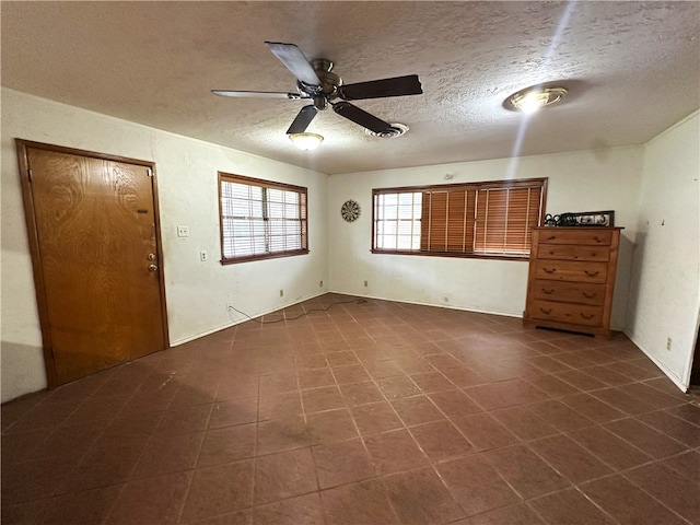636 S 11th St, Aransas Pass, TX 78336 - unfurnished room with a textured ceiling and ceiling fan