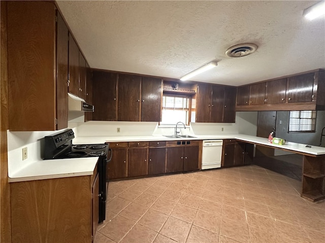 636 S 11th St, Aransas Pass, TX 78336 - kitchen with electric range, dishwasher, extractor fan, dark brown cabinets, and light countertops