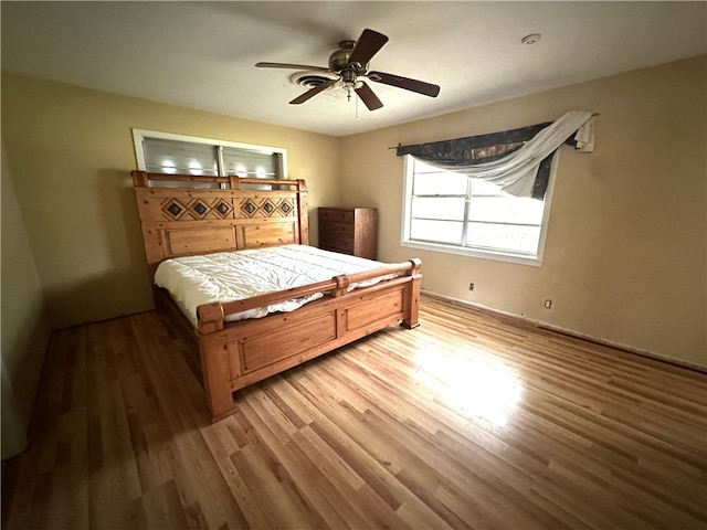 636 S 11th St, Aransas Pass, TX 78336 - bedroom featuring wood finished floors and ceiling fan