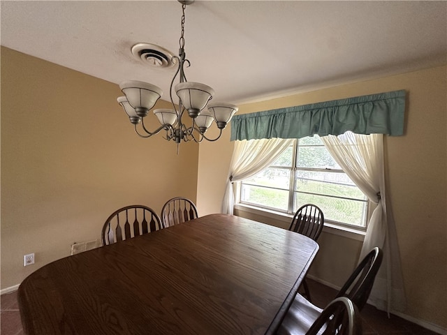 636 S 11th St, Aransas Pass, TX 78336 - dining room featuring a chandelier and dark carpet