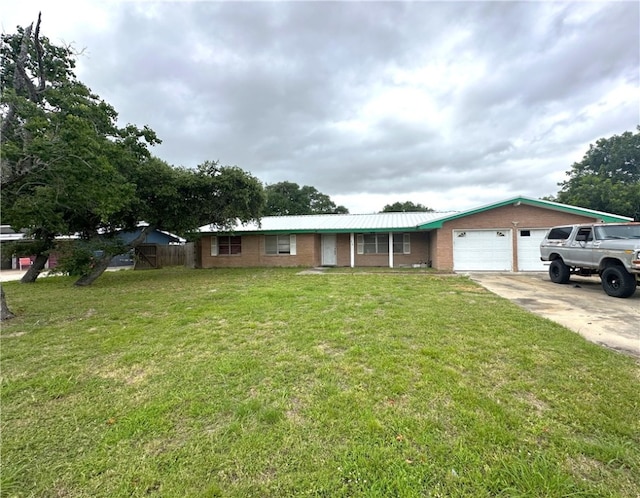 636 S 11th St, Aransas Pass, TX 78336 - single story home featuring a garage, concrete driveway, and brick siding