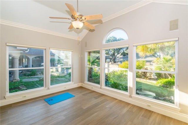 unfurnished sunroom featuring lofted ceiling and ceiling fan