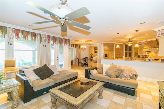 living room featuring light tile patterned floors and crown molding