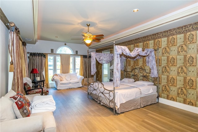 bedroom featuring wood-type flooring and ceiling fan