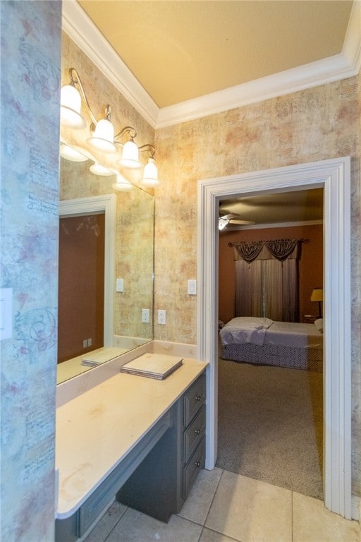 bathroom featuring ornamental molding, vanity, and tile patterned floors