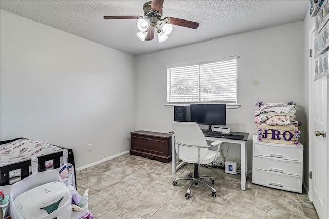 office with a textured ceiling and ceiling fan