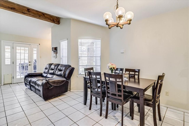 dining space featuring a wealth of natural light, light tile patterned flooring, and a chandelier