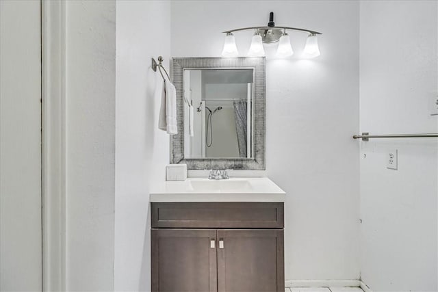 bathroom with a shower with shower curtain and vanity