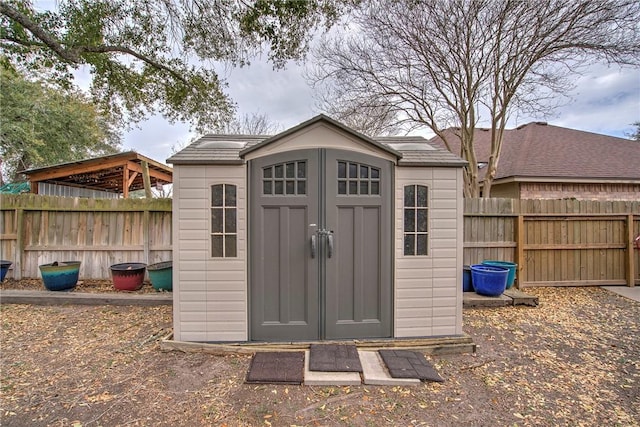 view of shed featuring a fenced backyard