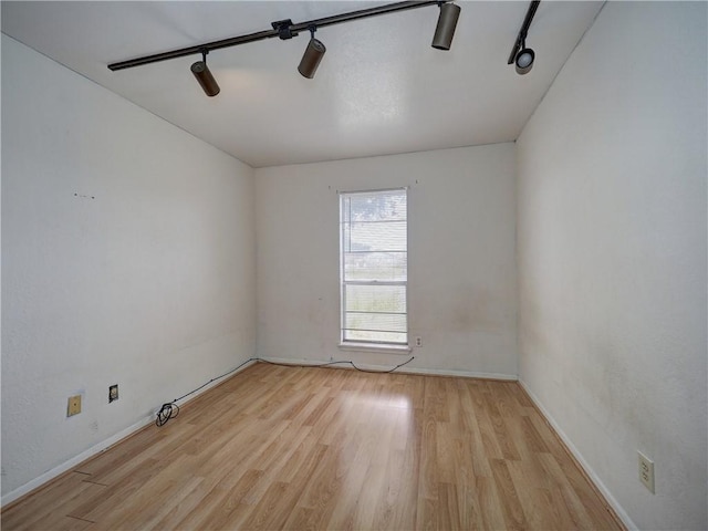 2100 Memorial Pkwy, Portland, TX 78374 - unfurnished room with track lighting, wood finished floors, and baseboards