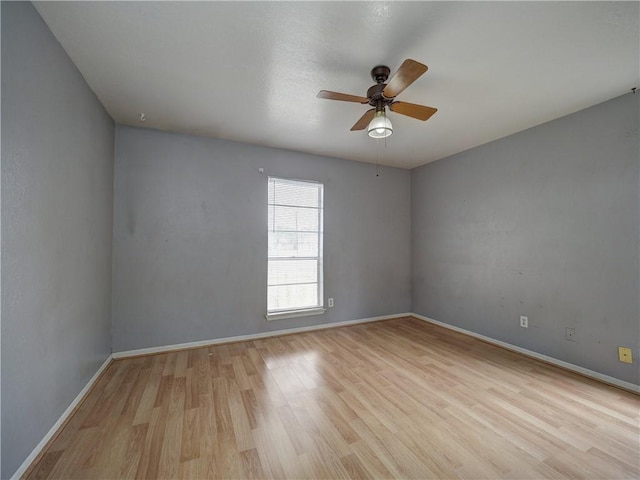 2100 Memorial Pkwy, Portland, TX 78374 - unfurnished room with ceiling fan, wood finished floors, and baseboards