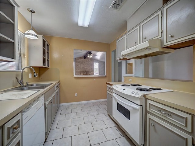 2100 Memorial Pkwy, Portland, TX 78374 - kitchen with white appliances, under cabinet range hood, a sink, open shelves, and plenty of natural light