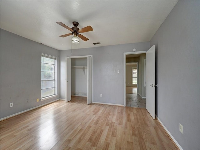 2100 Memorial Pkwy, Portland, TX 78374 - unfurnished bedroom featuring light wood-type flooring, baseboards, a closet, and a ceiling fan
