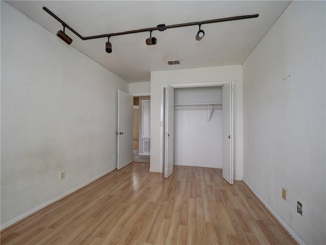 2100 Memorial Pkwy, Portland, TX 78374 - unfurnished bedroom with light wood-style flooring, baseboards, and a closet