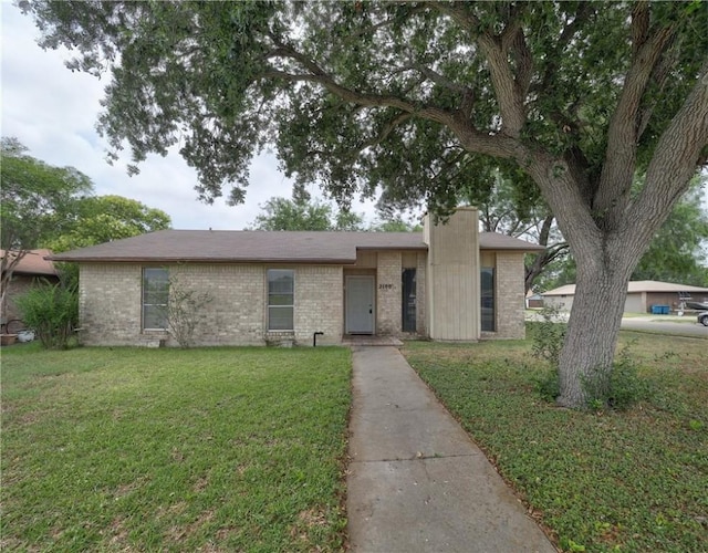 2100 Memorial Pkwy, Portland, TX 78374 - view of front facade featuring brick siding and a front yard