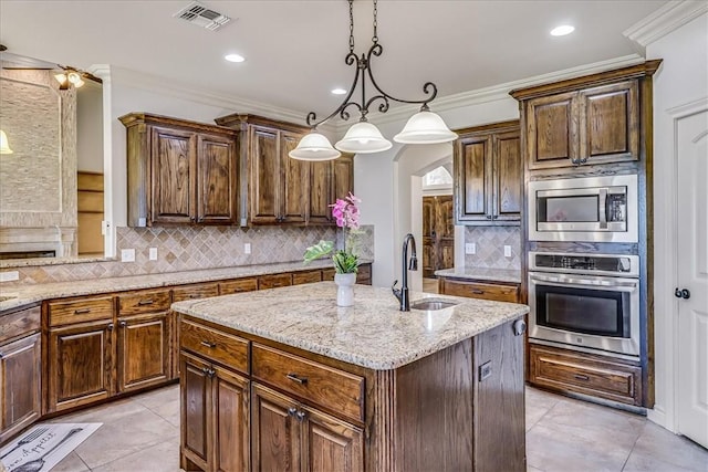 6241 Lago Vista Dr, Corpus Christi, TX 78414 - kitchen featuring stainless steel appliances, backsplash, arched walkways, light stone counters, and a center island with sink