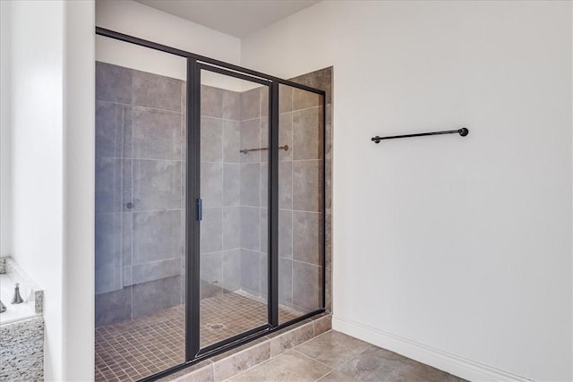 6241 Lago Vista Dr, Corpus Christi, TX 78414 - bathroom featuring a shower stall, tile patterned floors, and a bath