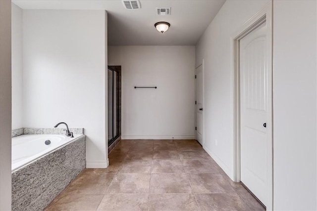 6241 Lago Vista Dr, Corpus Christi, TX 78414 - bathroom with a garden tub, a shower stall, and tile patterned floors